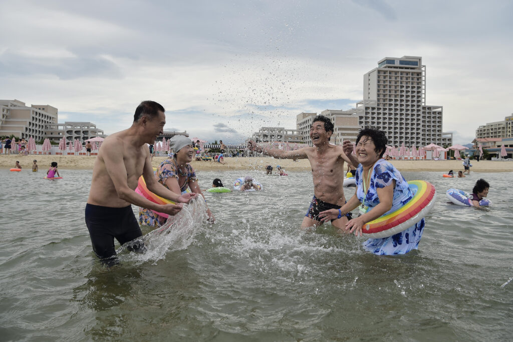 Domestic tourists visit the beach at Wonsan Kalma Coastal Tourist Area in Wonsan, North Korea's Kangwon Province on July 2. (AFP)