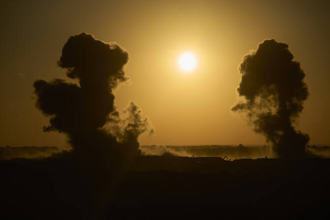 Smoke rises following explosion near destroyed buildings in Gaza, as seen from southern Israel, on Sunday, July 6. (AP)