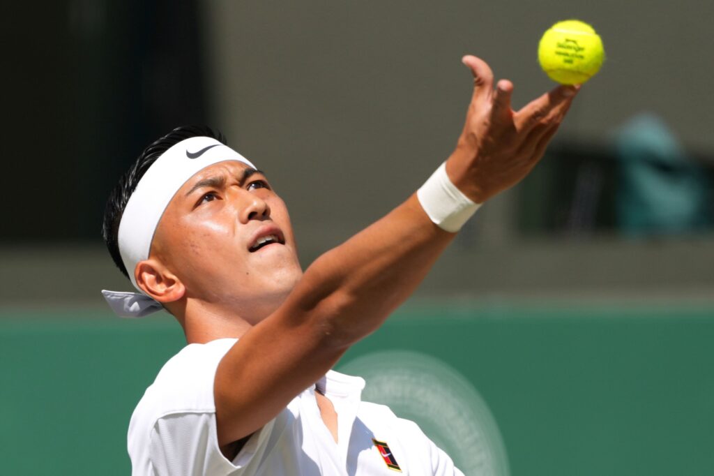 Tokito Oda of Japan serves to Alfie Hewett of Britain during the men's wheelchair singles final match at the Wimbledon Tennis Championships in London, Sunday, July 13, 2025.(AP)