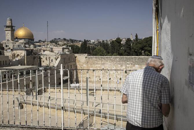 A Jewish man prays near the empty Western Wall in the Old City of Jerusalem, June 23, 2025. (AFP)