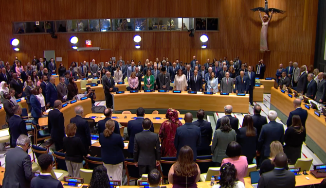 Attendees at the French-Saudi-sponsored conference at the United Nations on promoting a two-state solution to the conflict between Palestinians and Israelis stand for a moment of silence for all victims since Oct. 7, 2023. (Screenshot/UNTV)