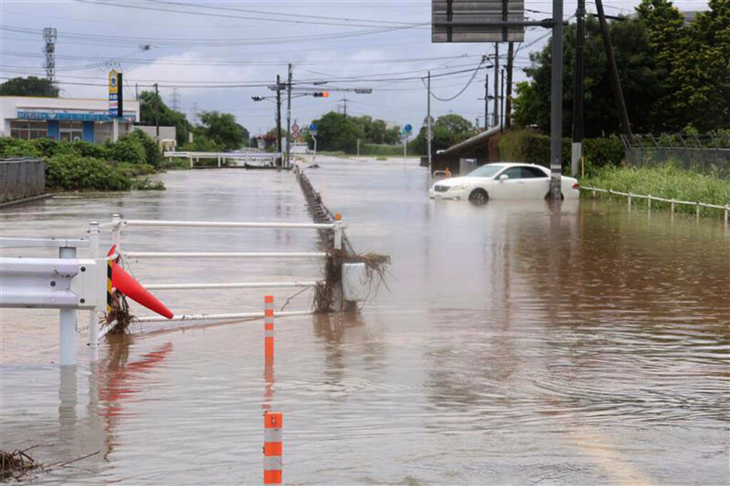 Roads are flooded due to heavy rain in Kumamoto, southern Japan Monday, Aug. 11, 2025. (Kyodo News via AP)