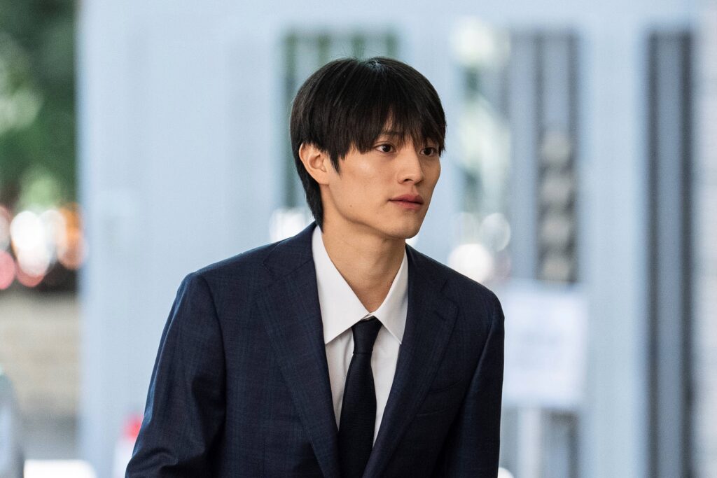 J-pop star Kenshin Kamimura arrives at the West Kowloon Magistrates' Courts to hear verdict over his indecent assault case in Hong Kong, Wednesday, August 13, 2025. (AP)