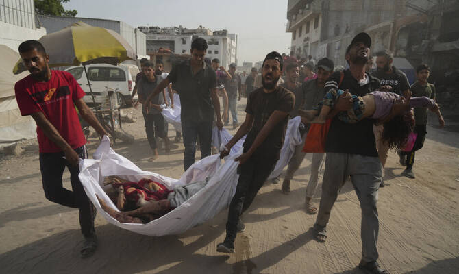 The bodies of Palestinians killed by an Israeli airstrike are brought to Shifa Hospital in Gaza City Monday, Aug. 11, 2025. (AP)