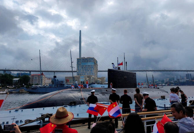 People take part in a ceremony marking the start of the upcoming Russian-Chinese joint naval drills in the Sea of Japan, following the arrival of Chinese military vessels in Vladivostok, Russia, July 31, 2025. (Russian Defense Ministry/Russia’s Pacific Fleet via Reuters)