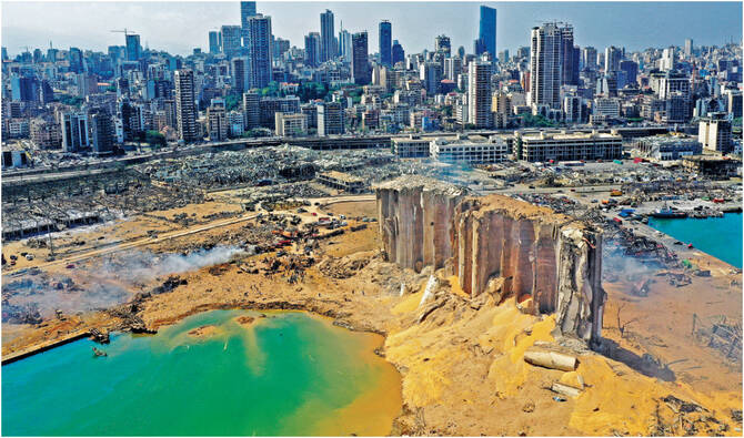 An aerial view shows the massive damage at Beirut port's grain silos and the area around it on August 5, 2020, one day after a massive explosion hit the heart of the Lebanese capital. (AFP)
