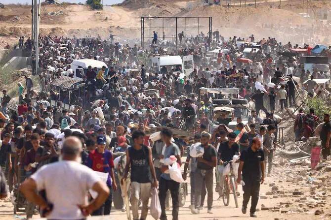 Displaced Palestinians gather to receive aid run by the US and Israeli-backed Gaza Humanitarian Foundation (GHF) at the so-called 