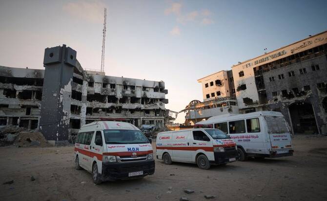 Ambulances are parked next to the main buildings of Shifa Hospital in Gaza City, Friday, July 4, 2025. (AP Photo)