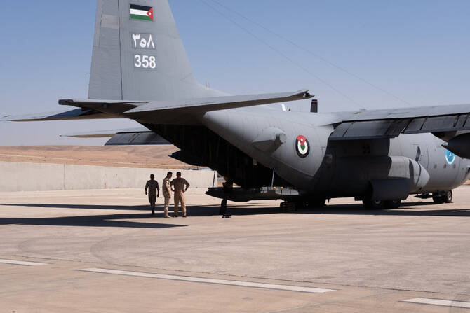 A view of a Royal Jordanian Air Force's C-130 military aircraft being prepared at an air base in Amman for another humanitarian airdrop mission on Aug. 7, 2025. (AN photo by Sherbel Dessi)