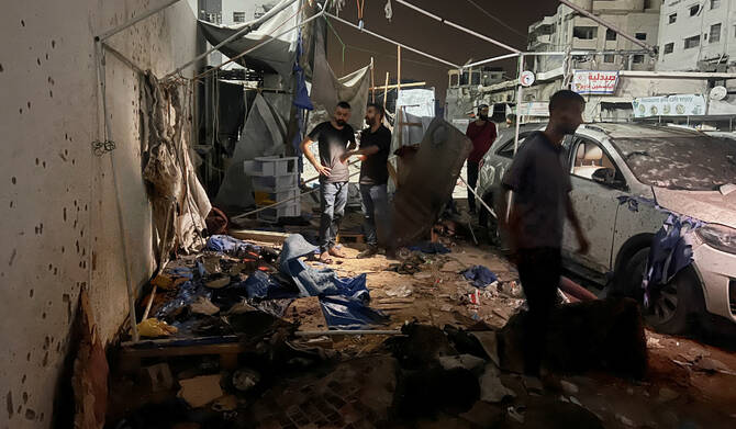 Palestinians inspect the site of an Israeli strike where Al Jazeera says its journalists Anas Al Sharif, Mohammed Qreiqeh and three photojournalists were killed, in Gaza City, August 11, 2025. (REUTERS)