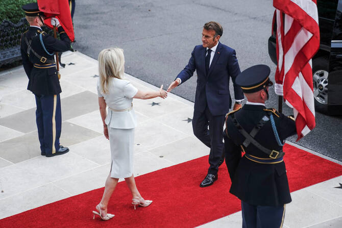 US Chief of Protocol Monica Crowley greets French President Emmanuel Macron as he arrives at the White House amid negotiations to end the Russian war in Ukraine. (Reuters)