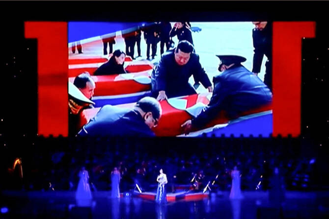 This frame grab from Korean Central Television taken on June 29, 2025 and released via AFPTV on July 1 shows a screen displaying North Korea's leader Kim Jong Un looking at coffins during a performance attended by Kim and Russian Minister of Culture Olga Lyubimova in Pyongyang. (AFP)
