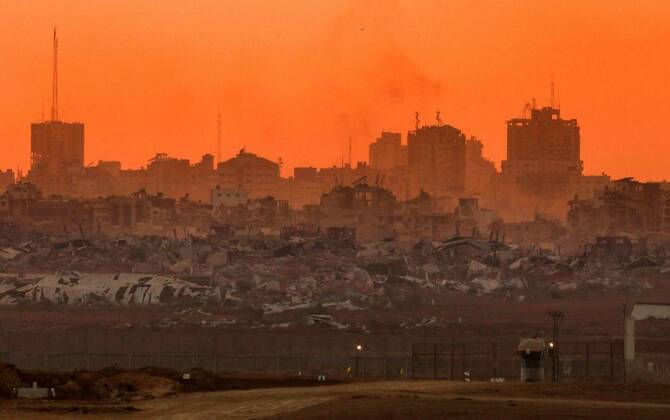 Destroyed buildings in Gaza are visible, as the sun sets, from Israel, Aug. 21, 2025. (AFP)