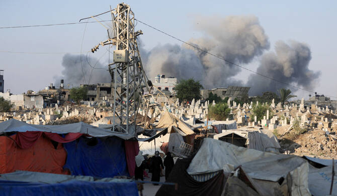 Smoke rises following an Israeli strike, in Gaza City, August 23, 2025. (REUTERS)