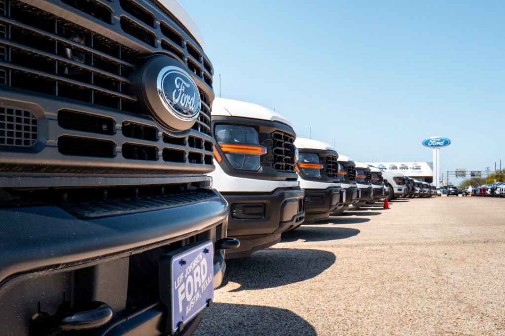 Ford-150 pickup trucks are displayed for sale at a dealership on March 24, 2025 in Austin, Texas. (AFP)