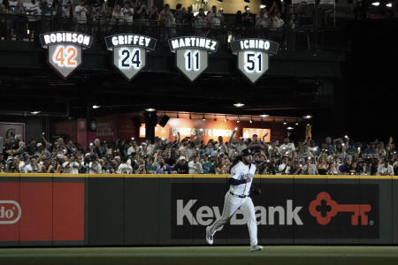 Seattle Mariners closing pitcher Andres Munoz runs from the bullpen with the retired jersey number 51 of Mariners legend Ichiro Suzuki behind him at the start of the ninth inning of a baseball game against the Tampa Bay Rays, Saturday, Aug. 9, 2025, in Seattle. (AP)