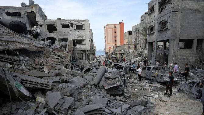 Palestinians inspect a mosque after it was hit by an Israeli airstrike, Shati refugee camp, Gaza City, Oct. 9, 2023. (AP Photo)