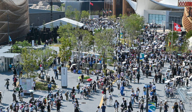 This general view shows people walking around various pavilions as they visit the 2025 Osaka Expo in Osaka on May 14, 2025. (AFP