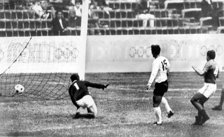 Japan's Kunishige Kamamoto scores a goal against the Mexican team at Mexico's Azteca Stadium on Oct. 24, 1968. (AP, file)