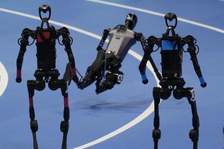 A robot falls at the end of the 100m race at the World Humanoid Robot Games held in Beijing, China, Sunday, Aug. 17, 2025. (AP)