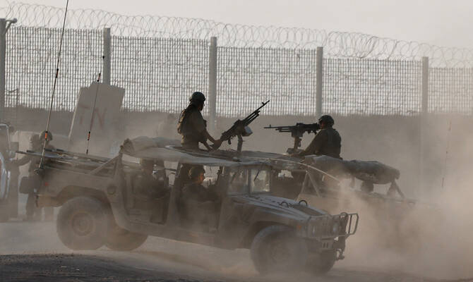 Israeli military vehicles operate, near the Israel-Gaza border, in Israel, August 16, 2025. (Reuters)