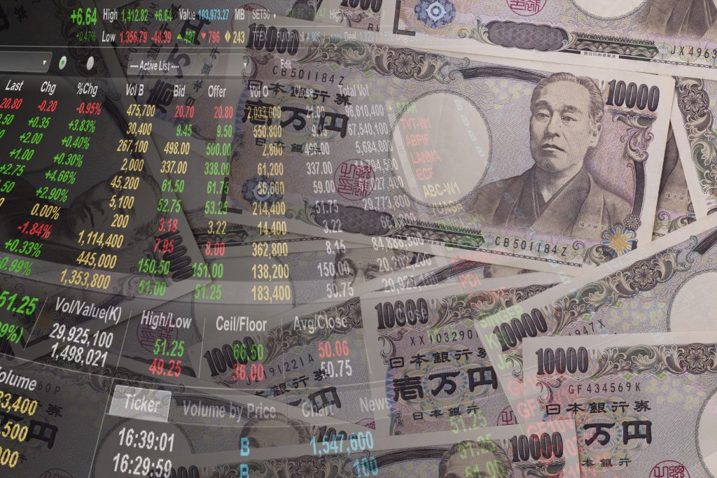 株式市場と日本円。(Shutterstock)