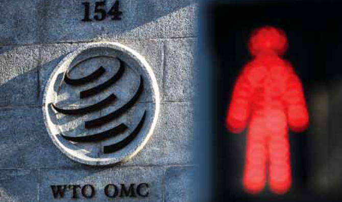 ジュネーブの世界貿易機関（WTO）本部の入り口横に点灯する、赤信号。 （画像：AFP）