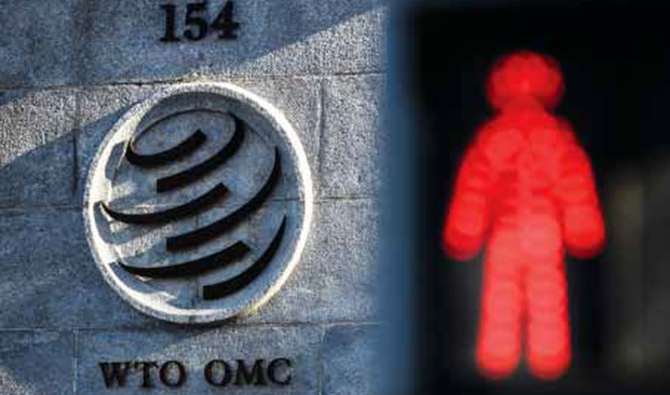 ジュネーブの世界貿易機関(WTO)本部の入り口横に点灯する、赤信号。 (画像:AFP)
