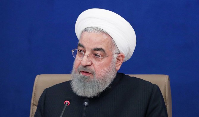 2021年1月20日、イラン大統領府から配布された資料写真には、首都テヘランで閣議の議長を務めるイランのハサン・ロウハニ大統領が写っている。（AFP通信）
