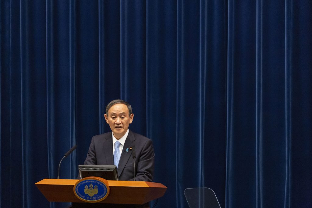 会議で首相は21~22年度に実施する具体策を6月をめどに策定することなどを指示。(AFP)