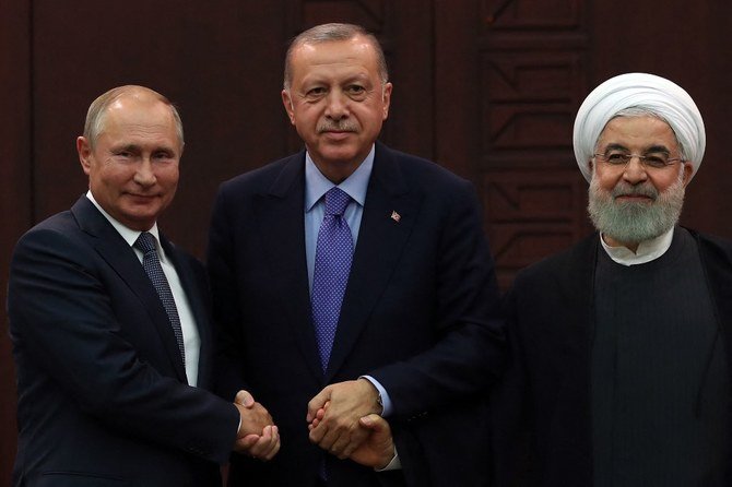 2019年9月16日、アンカラでの三国会議後。左から、ロシアのウラジーミル・プーチン大統領、トルコのタイイップ・エルドアン大統領、そしてイランのハサン・ロウハニ大統領。(AFP)