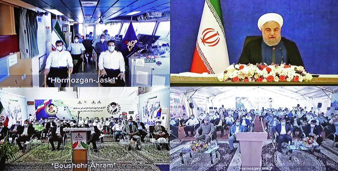 イランのハサン・ローハニ大統領（右上）がジャースクの石油ターミナルを落成させている様子を示す、イラン大統領府公開写真。（AFP）