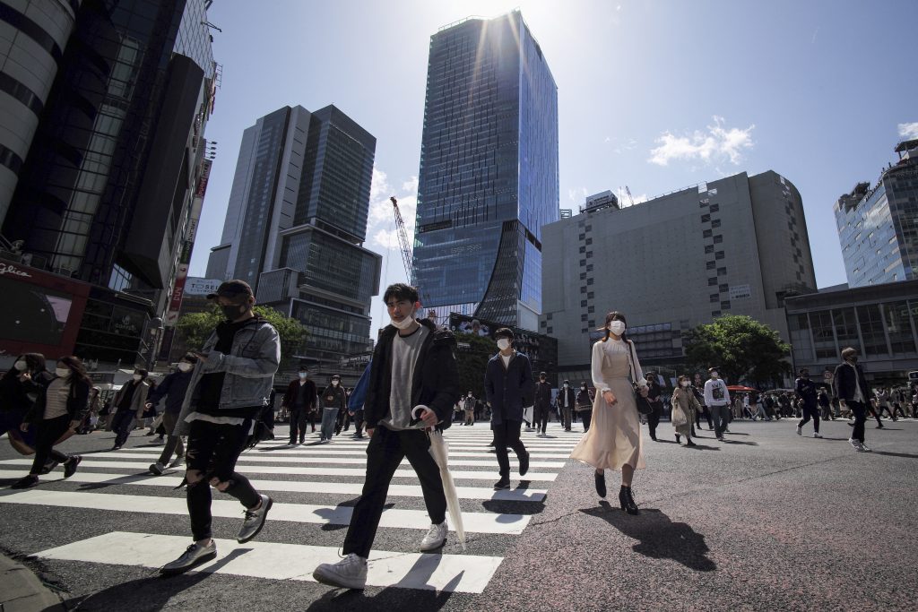 国内では4日、新たに1万4207人の新型コロナウイルス感染が確認された。(AFP)