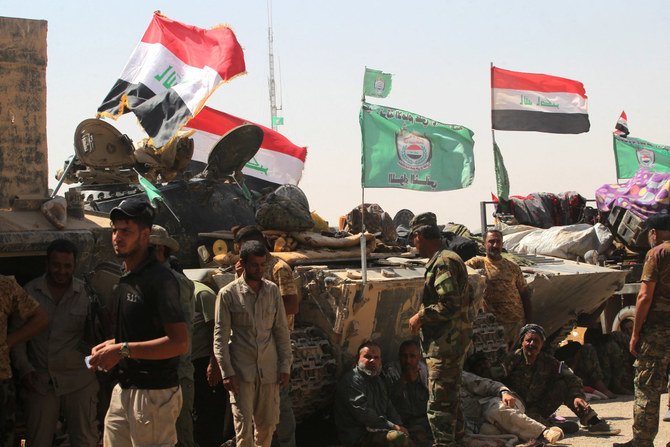 イラクのハシュド民兵は、同国の治安部隊の公式な一部であり、政府から資金提供を受けている。（AFP通信）