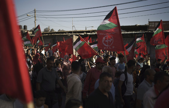 ガザ市でパレスチナ解放人民戦線（PFLP）が主催した集会に参加するパレスチナ人。（資料/AP）