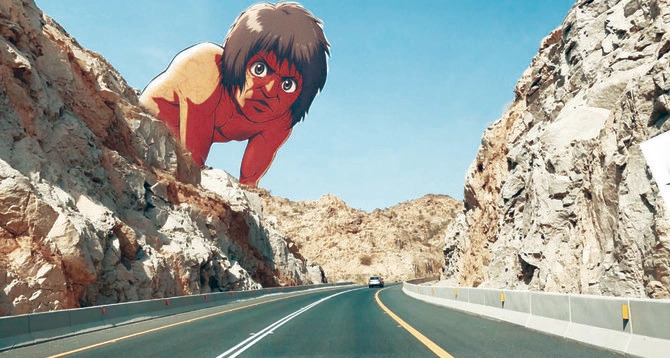 タイフの山間を抜ける有名なアル・シャファ道路の山陰から現れる日本アニメ「進撃の巨人」の巨人。（提供）