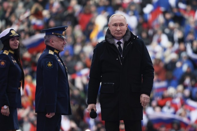 22日にモスクワのルジニキ・スタジアムで行われた愛国コンサートに出席したロシアのプーチン大統領(AFP)