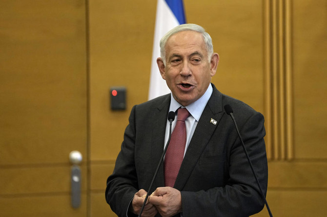 エルサレムのイスラエル国会「クネセト」において、自身が率いるリクード党のメンバーに向けて話すイスラエルのベンヤミン・ネタニヤフ首相。（AP通信）