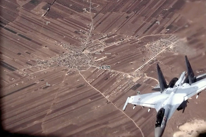 この画像は米空軍が公開した動画の一部で、2023年7月5日にシリア上空でロシア軍のSu-35が米空軍の無人偵察機MQ-9リーパーの近くを飛行する様子を写している。(AP通信)