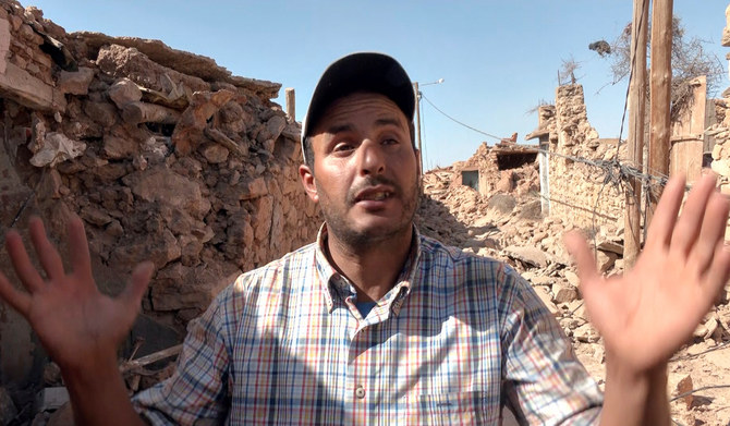 2023年9月10日、モロッコで発生した大地震の後、高アトラス山脈の人里離れた村タフェガフテで、ロイター通信のインタビューに身振り手振りで答えるハミド・ベン・ヘンナさん。彼は今回の大地震で息子のマルアン君を亡くした。この静止画像は動画から抽出。（ロイター）