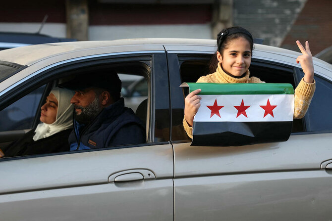 シリアの新政府報道官オベイダ・アルナウト氏は、移行期間は3か月間続くと述べた。（AFP）