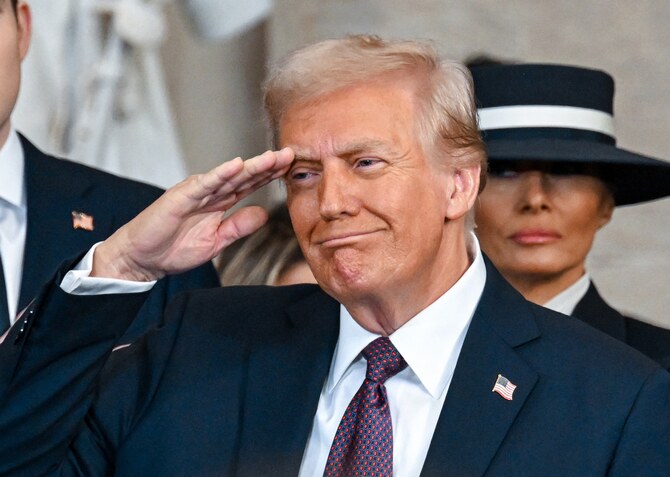 1月20日、ワシントンD.C.でドナルド・トランプ氏の第47代大統領就任式に臨むドナルド・トランプ大統領とメラニア・トランプ氏(AFP=時事)