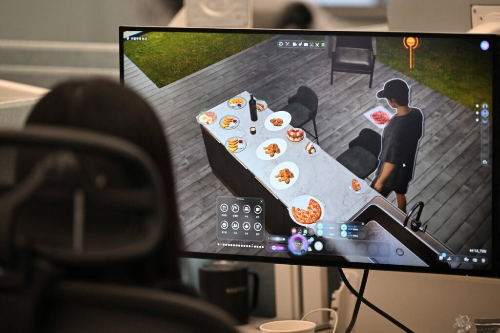 2025年3月27日、ソウル近郊の城南市にある「InZOI」スタジオで、ゲームパブリッシャー「Krafton」の開発者が、人生シミュレーションゲーム「InZOI」の開発作業を行っている。韓国のゲームパブリッシャー「Krafton」は3月28日、人生シミュレーションゲームの早期アクセスを開始し、20年以上も人気を博している「The Sims」シリーズに、初めて直接のライバル作品で挑戦した。(AFP)